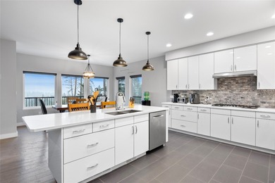 Welcome to this stunning contemporary walk-out rancher nestled on  in  - for sale on GolfHomes.com, golf home, golf lot