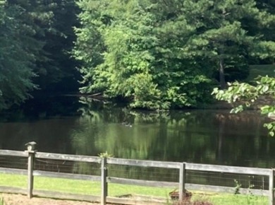 This property is a rare find in the upscale Holly on The Golf Club At Bradshaw Farm in Georgia - for sale on GolfHomes.com, golf home, golf lot