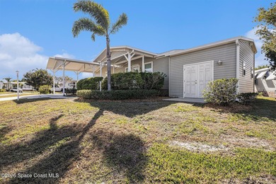 Nestled in the charming community of Barefoot Bay, this stunning on Barefoot Bay Golf Course in Florida - for sale on GolfHomes.com, golf home, golf lot