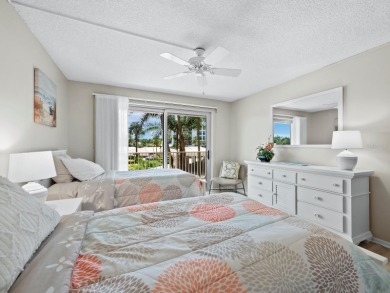 This inviting residence at the Islander Club of Longboat Key on Links on Longboat Golf Club in Florida - for sale on GolfHomes.com, golf home, golf lot