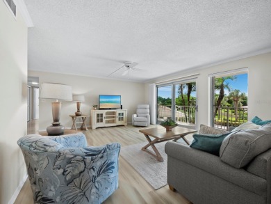 This inviting residence at the Islander Club of Longboat Key on Links on Longboat Golf Club in Florida - for sale on GolfHomes.com, golf home, golf lot
