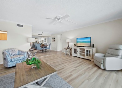 This inviting residence at the Islander Club of Longboat Key on Links on Longboat Golf Club in Florida - for sale on GolfHomes.com, golf home, golf lot