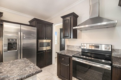 Nestled in the charming community of Barefoot Bay, this stunning on Barefoot Bay Golf Course in Florida - for sale on GolfHomes.com, golf home, golf lot