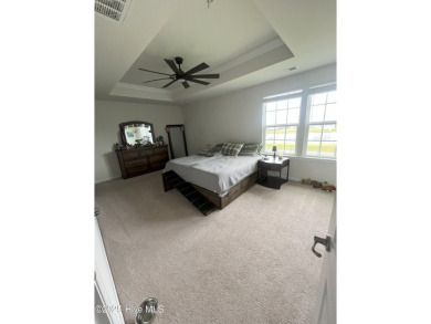 Stunning three-bedroom home in the highly desirable Lakeview on Eagle Creek Golf Club and Grill in North Carolina - for sale on GolfHomes.com, golf home, golf lot