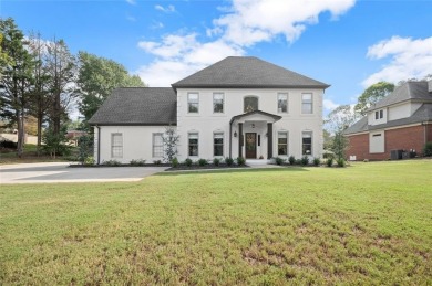 Absolutely stunning two-story home situated on the 6th fairway on Royal Lakes Golf and Country Club in Georgia - for sale on GolfHomes.com, golf home, golf lot