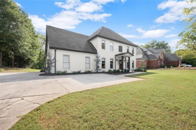 Absolutely stunning two-story home situated on the 6th fairway on Royal Lakes Golf and Country Club in Georgia - for sale on GolfHomes.com, golf home, golf lot