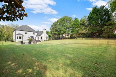 Absolutely stunning two-story home situated on the 6th fairway on Royal Lakes Golf and Country Club in Georgia - for sale on GolfHomes.com, golf home, golf lot