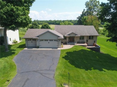 Discover luxurious living in this stunning 5-bedroom, 4-bathroom on Geneva Golf Club in Minnesota - for sale on GolfHomes.com, golf home, golf lot