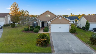Welcome to this charming 3-bedroom, 2-bath home with bonus room on Heron Point Golf Club in South Carolina - for sale on GolfHomes.com, golf home, golf lot