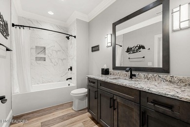 Luxury home for sale in WindRiver with gorgeous views of Tellico on Wind River Golf Course in Tennessee - for sale on GolfHomes.com, golf home, golf lot