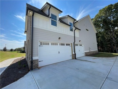 Stunning 2-story home with a 3rd car garage in a coveted on Traditions of Braselton Golf Club in Georgia - for sale on GolfHomes.com, golf home, golf lot