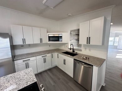 Beautifully renovated 2 bedroom, 2 bathroom home.  The home is on Del Tura Golf and Country Club in Florida - for sale on GolfHomes.com, golf home, golf lot