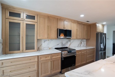 Step inside this freshly remodeled 3-bed, 2-bath pool home with on The Forest Country Club in Florida - for sale on GolfHomes.com, golf home, golf lot