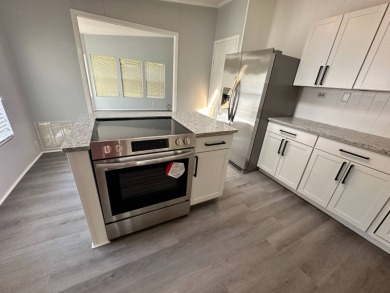 Beautifully renovated 2 bedroom, 2 bathroom home.  The home is on Del Tura Golf and Country Club in Florida - for sale on GolfHomes.com, golf home, golf lot