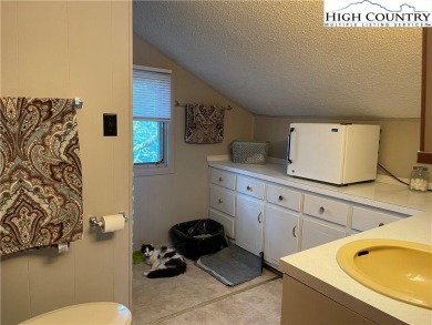Located in the highly sought-after Linville Land Harbor, this on Land Harbor Golf Course in North Carolina - for sale on GolfHomes.com, golf home, golf lot