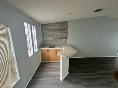 Beautifully renovated 2 bedroom, 2 bathroom home.  The home is on Del Tura Golf and Country Club in Florida - for sale on GolfHomes.com, golf home, golf lot
