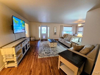 Beautiful, spacious home located at the 7th and 8th hole of on Desert Hawk At Pueblo West in Colorado - for sale on GolfHomes.com, golf home, golf lot