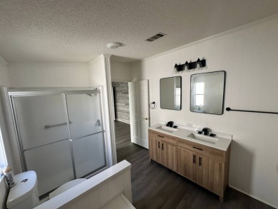 Beautifully renovated 2 bedroom, 2 bathroom home.  The home is on Del Tura Golf and Country Club in Florida - for sale on GolfHomes.com, golf home, golf lot