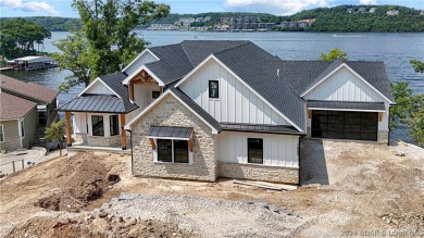 Welcome to this new construction home in Porto Cima @ Lake of on The Club At Porto Cima in Missouri - for sale on GolfHomes.com, golf home, golf lot