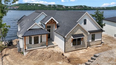 Welcome to this new construction home in Porto Cima @ Lake of on The Club At Porto Cima in Missouri - for sale on GolfHomes.com, golf home, golf lot