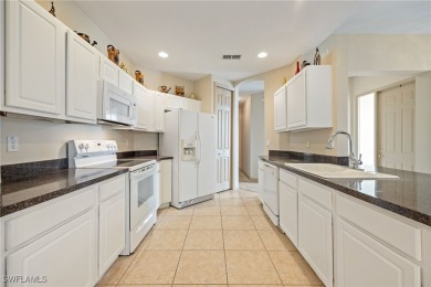 Maintenance-Free Living in Prime Naples Location - First Floor on Glen Eagle Golf and Country Club in Florida - for sale on GolfHomes.com, golf home, golf lot