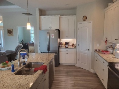 As you enter this 3 bedroom,  2 &1/2 bath, 3 car garage, canal on Rotonda Golf and Country Club - Long Marsh  in Florida - for sale on GolfHomes.com, golf home, golf lot