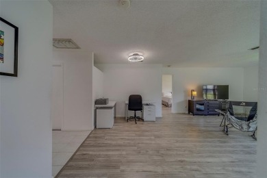 Welcome home to this light and airy 2 bedroom/2 bathroom corner on Mainlands Golf Club in Florida - for sale on GolfHomes.com, golf home, golf lot