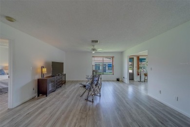Welcome home to this light and airy 2 bedroom/2 bathroom corner on Mainlands Golf Club in Florida - for sale on GolfHomes.com, golf home, golf lot