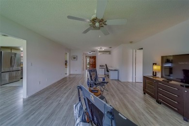 Welcome home to this light and airy 2 bedroom/2 bathroom corner on Mainlands Golf Club in Florida - for sale on GolfHomes.com, golf home, golf lot