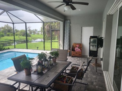 As you enter this 3 bedroom,  2 &1/2 bath, 3 car garage, canal on Rotonda Golf and Country Club - Long Marsh  in Florida - for sale on GolfHomes.com, golf home, golf lot