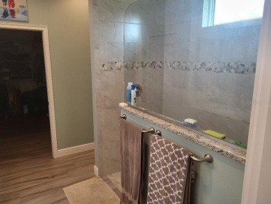 As you enter this 3 bedroom,  2 &1/2 bath, 3 car garage, canal on Rotonda Golf and Country Club - Long Marsh  in Florida - for sale on GolfHomes.com, golf home, golf lot