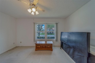 Welcome home to this light and airy 2 bedroom/2 bathroom corner on Mainlands Golf Club in Florida - for sale on GolfHomes.com, golf home, golf lot