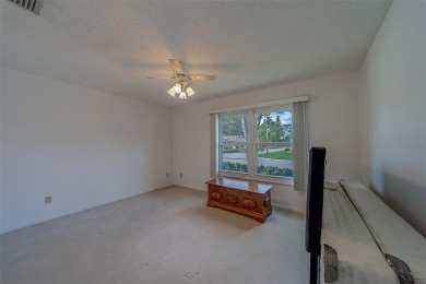 Welcome home to this light and airy 2 bedroom/2 bathroom corner on Mainlands Golf Club in Florida - for sale on GolfHomes.com, golf home, golf lot