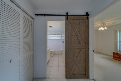 Welcome home to this light and airy 2 bedroom/2 bathroom corner on Mainlands Golf Club in Florida - for sale on GolfHomes.com, golf home, golf lot