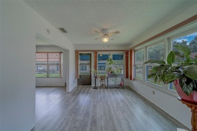 Welcome home to this light and airy 2 bedroom/2 bathroom corner on Mainlands Golf Club in Florida - for sale on GolfHomes.com, golf home, golf lot
