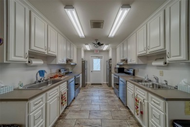 Welcome home to this light and airy 2 bedroom/2 bathroom corner on Mainlands Golf Club in Florida - for sale on GolfHomes.com, golf home, golf lot