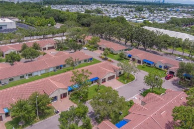 Welcome home to this light and airy 2 bedroom/2 bathroom corner on Mainlands Golf Club in Florida - for sale on GolfHomes.com, golf home, golf lot