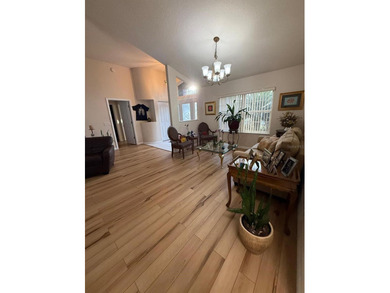 Step into this meticulously maintained three-bedroom, two-bath on The Grand Club Cypress Course in Florida - for sale on GolfHomes.com, golf home, golf lot