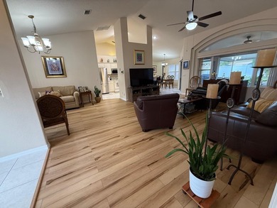 Step into this meticulously maintained three-bedroom, two-bath on The Grand Club Cypress Course in Florida - for sale on GolfHomes.com, golf home, golf lot