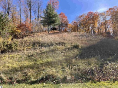 This parcel soaks up the views from hole #18 at the renowned on Shanty Creek Golf Course in Michigan - for sale on GolfHomes.com, golf home, golf lot