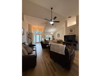 Step into this meticulously maintained three-bedroom, two-bath on The Grand Club Cypress Course in Florida - for sale on GolfHomes.com, golf home, golf lot