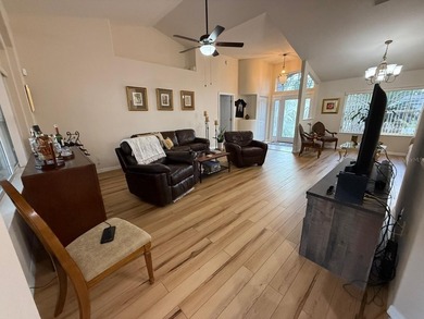 Step into this meticulously maintained three-bedroom, two-bath on The Grand Club Cypress Course in Florida - for sale on GolfHomes.com, golf home, golf lot