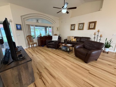 Step into this meticulously maintained three-bedroom, two-bath on The Grand Club Cypress Course in Florida - for sale on GolfHomes.com, golf home, golf lot