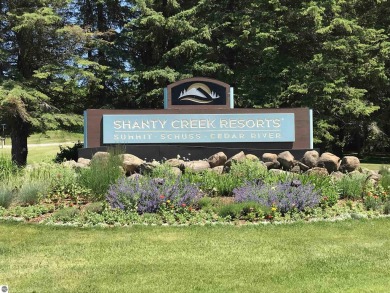 This parcel soaks up the views from hole #18 at the renowned on Shanty Creek Golf Course in Michigan - for sale on GolfHomes.com, golf home, golf lot