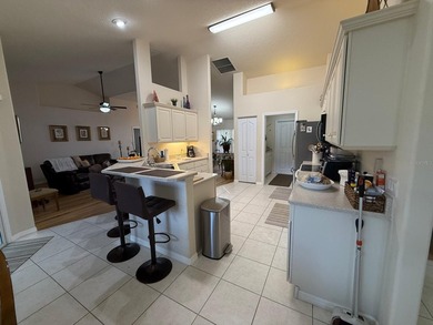 Step into this meticulously maintained three-bedroom, two-bath on The Grand Club Cypress Course in Florida - for sale on GolfHomes.com, golf home, golf lot