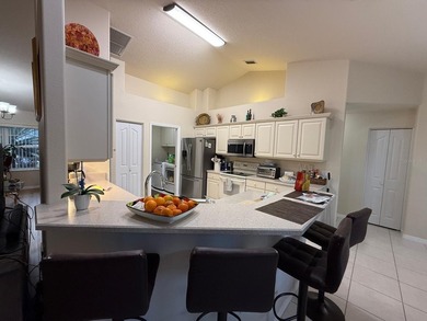 Step into this meticulously maintained three-bedroom, two-bath on The Grand Club Cypress Course in Florida - for sale on GolfHomes.com, golf home, golf lot