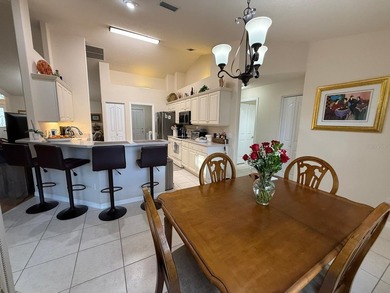 Step into this meticulously maintained three-bedroom, two-bath on The Grand Club Cypress Course in Florida - for sale on GolfHomes.com, golf home, golf lot