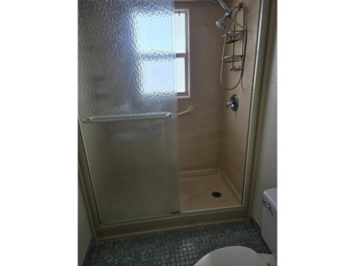 CONVENIENTLY LOCATED ACROSS FROM THE CLUBHOUSE & 2 POOLS, THIS on Poinciana Golf Club in Florida - for sale on GolfHomes.com, golf home, golf lot