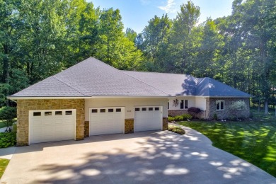 Nestled in the tranquil embrace of Timber Point Estates, 9102 on The Timbers Golf Club in Michigan - for sale on GolfHomes.com, golf home, golf lot