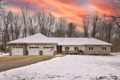 Nestled in the tranquil embrace of Timber Point Estates, 9102 on The Timbers Golf Club in Michigan - for sale on GolfHomes.com, golf home, golf lot